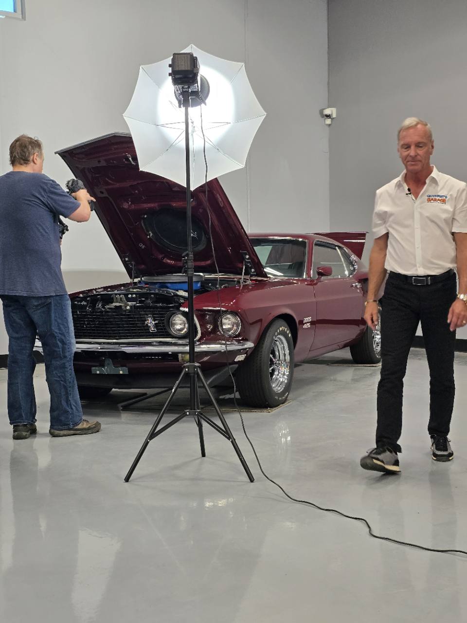 Jim Guthrie on camera during production inside Guthrie’s Garage